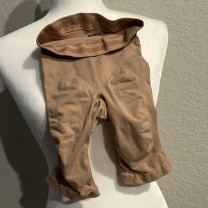 Skims high waisted above the knee shorts size S/M color ochre new without tags